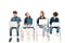 Four kids in denim clothes sitting on chairs and using laptops on white.