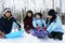 Four kids enjoying winter