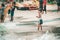 Four kids playing basketball in the jungle