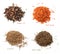 Four kinds of dried spices. A mixture of peppers, dried carrots, coriander, cumin seeds. White isolated background.