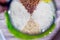 Four kinds of rice, white parboiled brown wild round lie in the dish raw