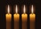 Four lighted advent candles