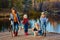 Four little girls catch fish on a wooden pontoon.Weekend at the lake. Fishing with friends.