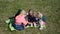 Four little girls playing on the lawn