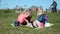 Four little girls playing on the lawn