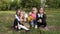 four little girls schoolgirls on a picnic in the park