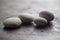 Four little white fluvial stones on wooden surface