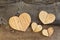 Four Love Valentines wooden hearts on old Elm background