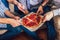 Four male friends eating pizza at home, close up