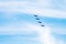 Four military fighter aircrafts in cloudy sky