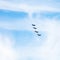 Four military fighter jets in cloudy sky