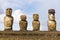 Four Moai statues in a row