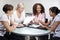 Four Modern Businesswomen In Office Meeting