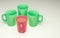 Four mugs for coffee of different colors. 3d rendering