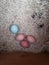 Four multicolored eggs in nest