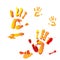 Four multicolored handprints on a white background. Concept for the festival of paints