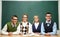 Four nerds in front of blackboard
