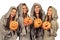 Four nuns holding halloween pumpkins