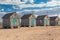 Four old beach huts