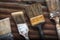 Four Old Crusty Household Paintbrushes Lined at an Angle Rusted Corrugated Metal Background