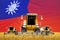 four orange combine harvesters on grain field with flag background, Taiwan Province of China agriculture concept - industrial 3D