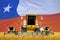 four orange combine harvesters on rye field with flag background, Chile agriculture concept - industrial 3D illustration