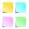 Four pastel colored sticky notes