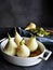 Four peeled pears ready to be roasted. Ingredients for recipe