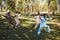 Four people doing tai chi exercises on grass outdoors