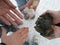 Four people hold different rocks of the salt lake in their hand