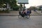 Four persons riding on one motorcycle heading for a school on National Highway 6 in Siem Reap,