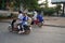 Four persons riding on one motorcycle heading for a school on National Highway 6 in Siem Reap,