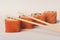 Four philadelphia sushi rolls with sticks