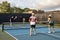 Four Pickleball Players Hitting