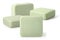 Four pieces of green toilet soap on a white background. Full depth of field.