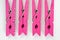 Four Pink Clothes Pins with Fun Patterns Flipped Top View