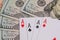 Four poker aces with dollar