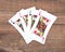 Four poker playing cards