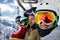 Four positive friend snowboarders on winter resort