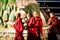 Four praying young buddhism monks at the Swayambhunath temple