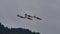 Four propeller planes perform a precise and synchronized barrel roll