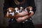 Four puppies of breed Jack Russell Terrier are sitting on the hands