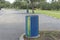 Four Recycle Bins in a Parking Lot