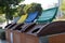 Four recycling garbage cans in gray, yellow, blue and green