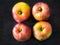 Four red apples, Belle de Boskoop