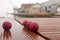 Four red basketballs on the panels of the harbor dull day