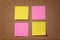 Four reminder sticky notes on cork board