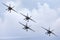 Four Royal Australian Air Force RAAF Boeing F/A-18F Super Hornet multirole fighter aircraft flying in formation.