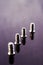 Four screws arranged in line in purple vintage tones