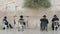 Four seated men praying at the wailing wall in jerusalem